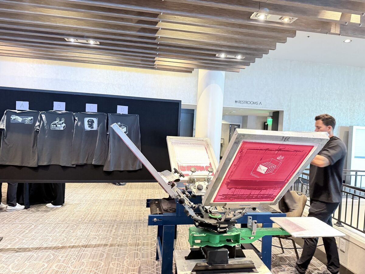 Press and dark apparel wall staged for a corporate event in a ballroom