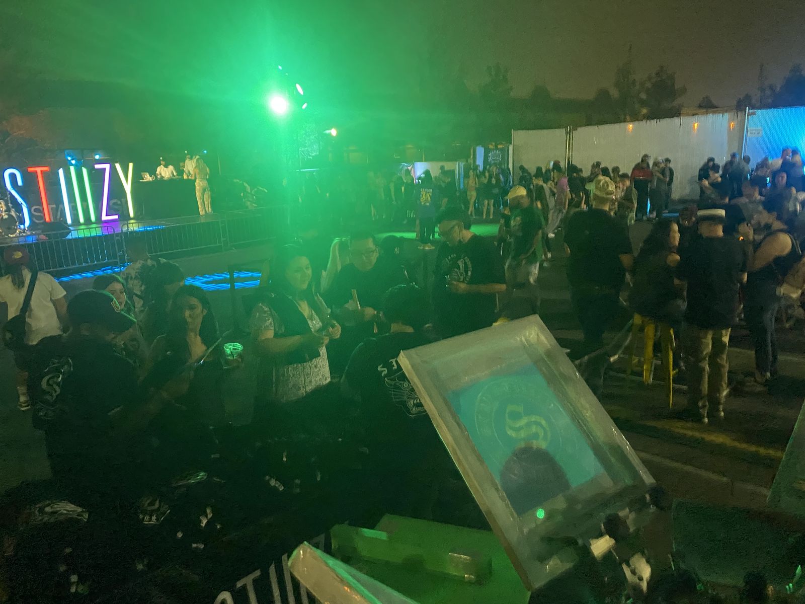 Live printing rig working through a crowd at an outdoor night festival